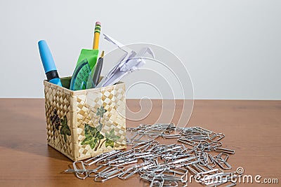 Stationery products in a box and an origami parrot Stock Photo