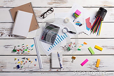 Stationery scattered on a wooden background. Stock Photo