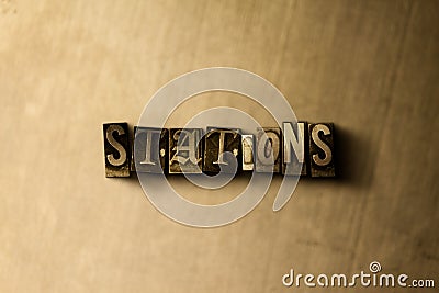 STATIONS - close-up of grungy vintage typeset word on metal backdrop Stock Photo