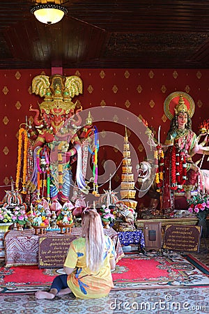 The statue according to the belief in Buddhism, bright colors in Thai temples Editorial Stock Photo