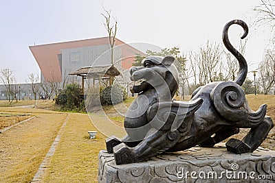 Statue of animal from ancient Chinese myth on sunny spring day Stock Photo