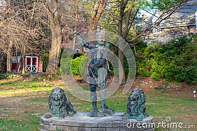 A Statue of an Archer With Two Lions Stock Photo