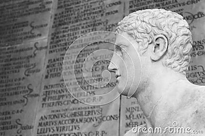 Statue of an athlete. On background some ancient roman inscription blurred. Rome Italy Editorial Stock Photo