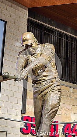 A statue of the baseball player Hank Aaron hitting a baseball inside of at Truist Park in Atlanta Georgia Editorial Stock Photo