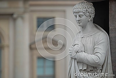 Statue of beautiful Roman noble man at the obelisk in the Old Market square Alter Markt in downtown of Potsdam, Germany Editorial Stock Photo