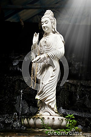 Statue of Bodhisattva Kuan Stock Photo