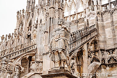 Statue of a brooding commander on the facade of the Duomo. Italy, Milan Editorial Stock Photo