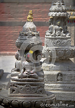 Statue of Buddha in front of small temple, Kathmandu, Nepal Stock Photo