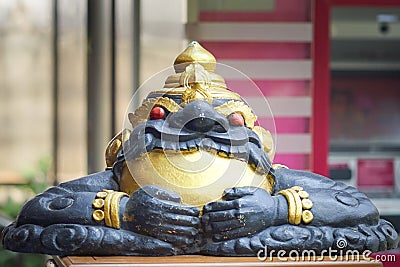 A statue of celestial monster which causes elipses by eating the sun or moon Rahu Editorial Stock Photo