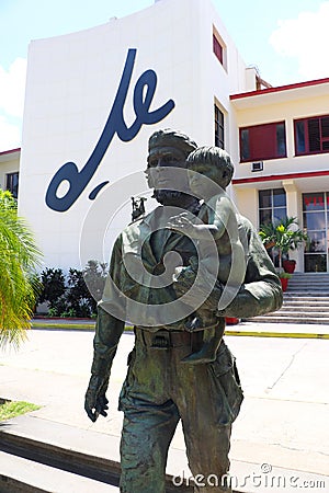 Statue of Che Guevara with child and the writing Che in the background in Santa Clara, Cuba Editorial Stock Photo