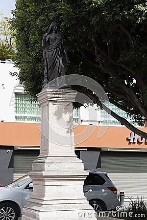 Statue on column in av. of the heroes, LeÃ³n Guanajuato Editorial Stock Photo