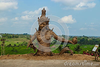 Statue of Dewi Sri, the goddess of rice, made from dried rice plant leaves, Located in the center of terraces Jatiluwih, a Unesco Editorial Stock Photo
