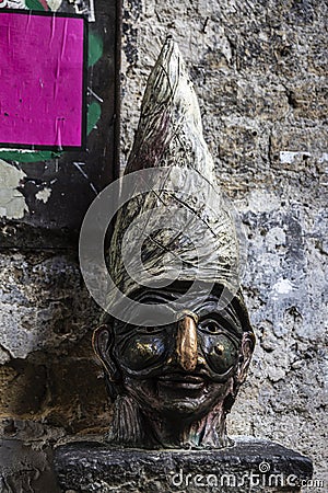 Statue with the face of Pulcinella in Naples, Italy Stock Photo