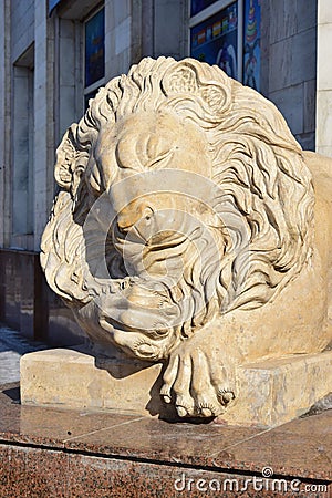 Statue featuring a lying lion in Astana Editorial Stock Photo