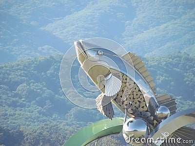 The Statue of fish in middle of Soyanggang or soyang river with blue sky Stock Photo