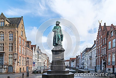 Statue of the Flemish painter Jan van Eyck in Bruges. Editorial Stock Photo