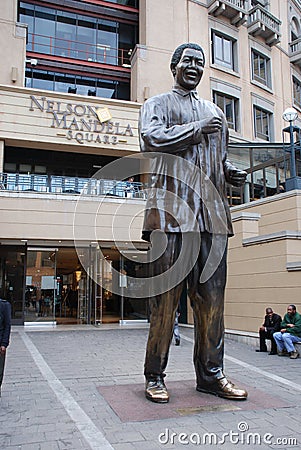 The statue of former president Nelson Mandela in Nelson Mandela Square in Sandton, Johannesburg Editorial Stock Photo