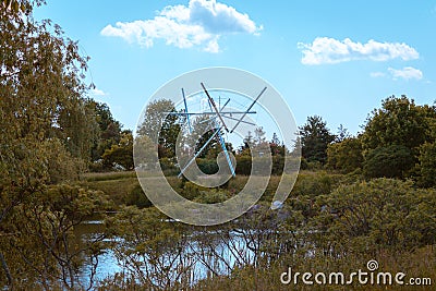 Statue at the Frederik Meijer Gardens standing prominently above the landscape Editorial Stock Photo