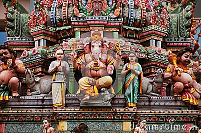 Statue of Ganesh on a colorful indian temple facade Stock Photo