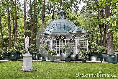 Statue and garden house at Peterhof Gardens close to St. Petersburg in Russia Editorial Stock Photo
