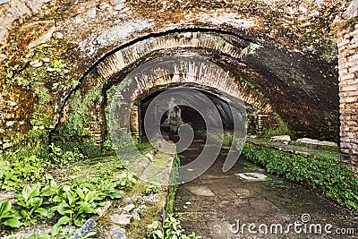 Statue of the god Mithras killing a bull in the thermal s mithraeum in archaeological excavations of Ostia Antica Stock Photo