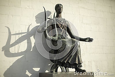 Statue with harp. Ancient Greek goddess made of bronze. Statue of nymph Editorial Stock Photo