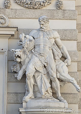 Statue of Hercules capturing Cerberus at the Michaelerplatz entrance to the Michaelertrakt at the Hofburg Palace, Vienna Stock Photo