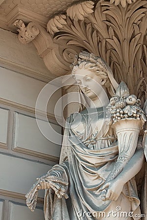 Statue with horn of plenty Stock Photo