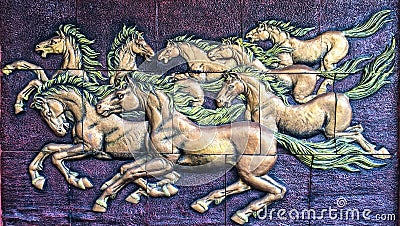 Statue Horses running on a red background Editorial Stock Photo