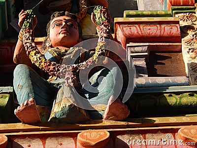 Statue of Indian Hindu woman gesture welcome people in the entrance of temple Editorial Stock Photo