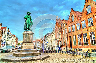Statue of Jan van Eyck, an Early Netherlandish painter in Bruges, Belgium Editorial Stock Photo