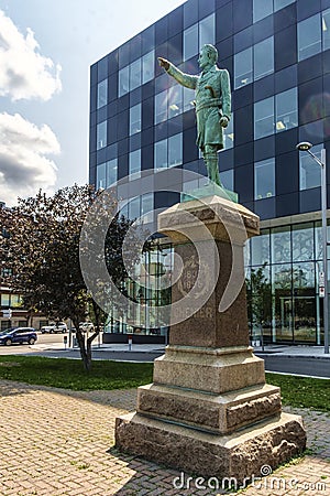 Statue of Jean-Olivier ChÃ©nier (in front of the CHUM) Editorial Stock Photo