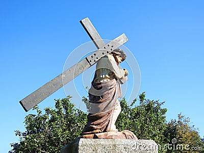 Statue of Jesus Christ carrying cross Stock Photo