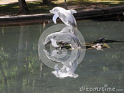 The Statue of jumping dolphins in the park, Kuala Lumpur, Malaysia Stock Photo