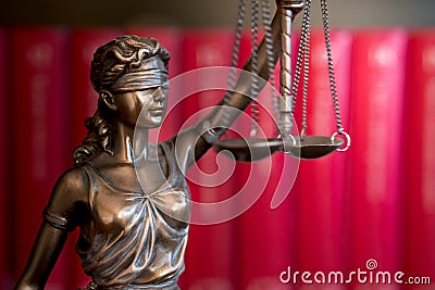 Statue of Justice with scales in lawyer office. Stock Photo