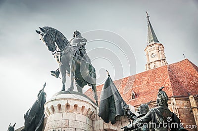 Statue of King Mathias in front of the church of Saint Michael Stock Photo