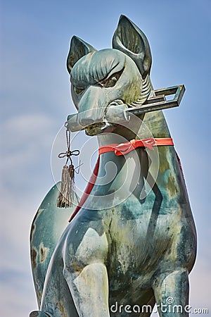 Statue of a Kitsune in Fushimi Inari Stock Photo