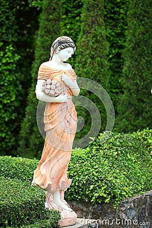 Statue lady in the garden Stock Photo