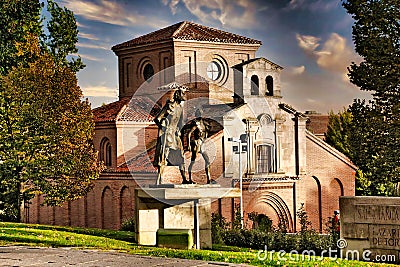 Statue of Lazarillo de Tormes leading the blind man in the background of the Iglesia de Santiago in Salamanca Spain Stock Photo