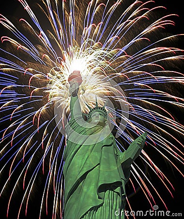 A Statue of Liberty Fourth of July Fireworks Celebration Stock Photo