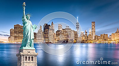 The Statue of Liberty with Lower Manhattan background in the evening, Landmarks of New York City Stock Photo