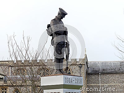 Statue of a lone soldier on a plinth in The Memorial Gardens in Old Amersham, Buckinghamshire, UK Editorial Stock Photo