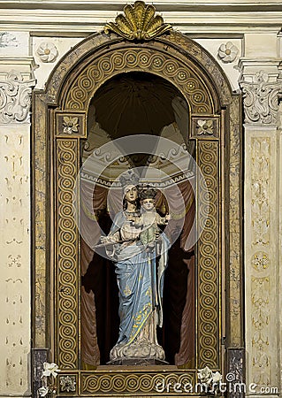 Statue of Madonna standing and holding the Child Jesus in the Basilica of Saint Apollinare Nuovo in Ravena, Italy. Editorial Stock Photo