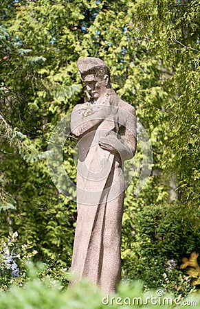 Statue of a man at Rainis Cemetery Editorial Stock Photo