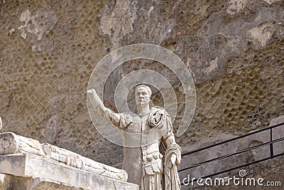 Statue of Marcus Nonius Balbus in ruins of an ancient city near Naples, Herculaneum, Italy Editorial Stock Photo