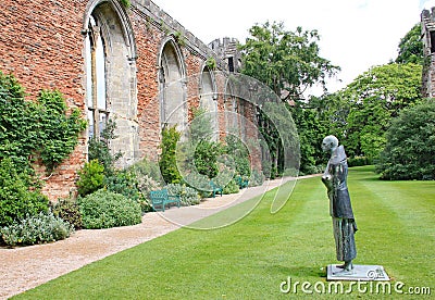 A statue of a monk n the grounds of Wells Cathedral in Somerset, England Editorial Stock Photo