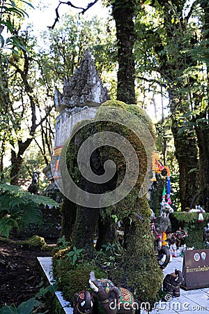 Statue of a mossy elephant Stock Photo