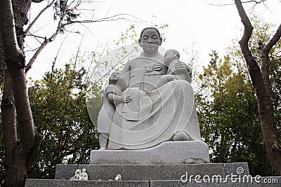 Statue Mother and Child in Haedong Yonggungsa temple for korean people and foreign travelers travel visit respect praying bless Editorial Stock Photo