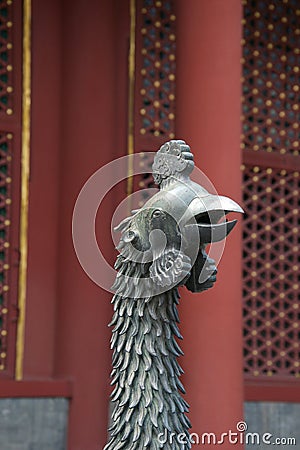 Statue of mythical chinese bird. Head, beak, feathered neck Stock Photo