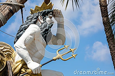 Statue of Neptune, god of freshwater and the sea in Roman religion, observing with his hand on his forehead and the trident. He is Stock Photo